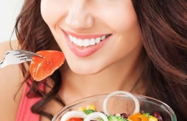 woman with vegetarian vegetable salad